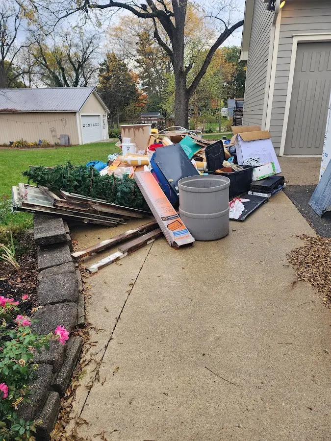 Dumpster being loaded with debris for Commercial Dumpster Rental in Starkville